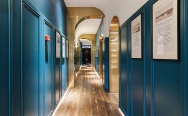 Gulangyu (Kulangsu) Xiamen Hotel Gallery-Teal Corridor Stylish teal - colored hallway in a Gulangyu (Kulangsu) Xiamen hotel, featuring wooden floors, gold archways, and framed artworks on walls